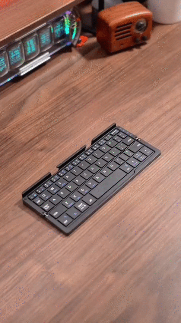 Ultra-Compact Foldable Bluetooth Keyboard with Phone Stand - Image 3
