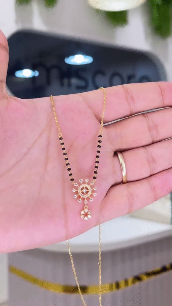 Traditional Gold-Toned Beaded Necklace with Sunburst Pendant - Image 2